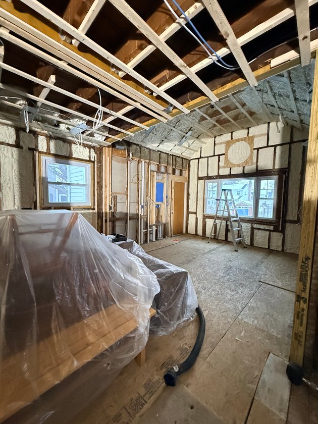 room before plastering with exposed framing and insulation