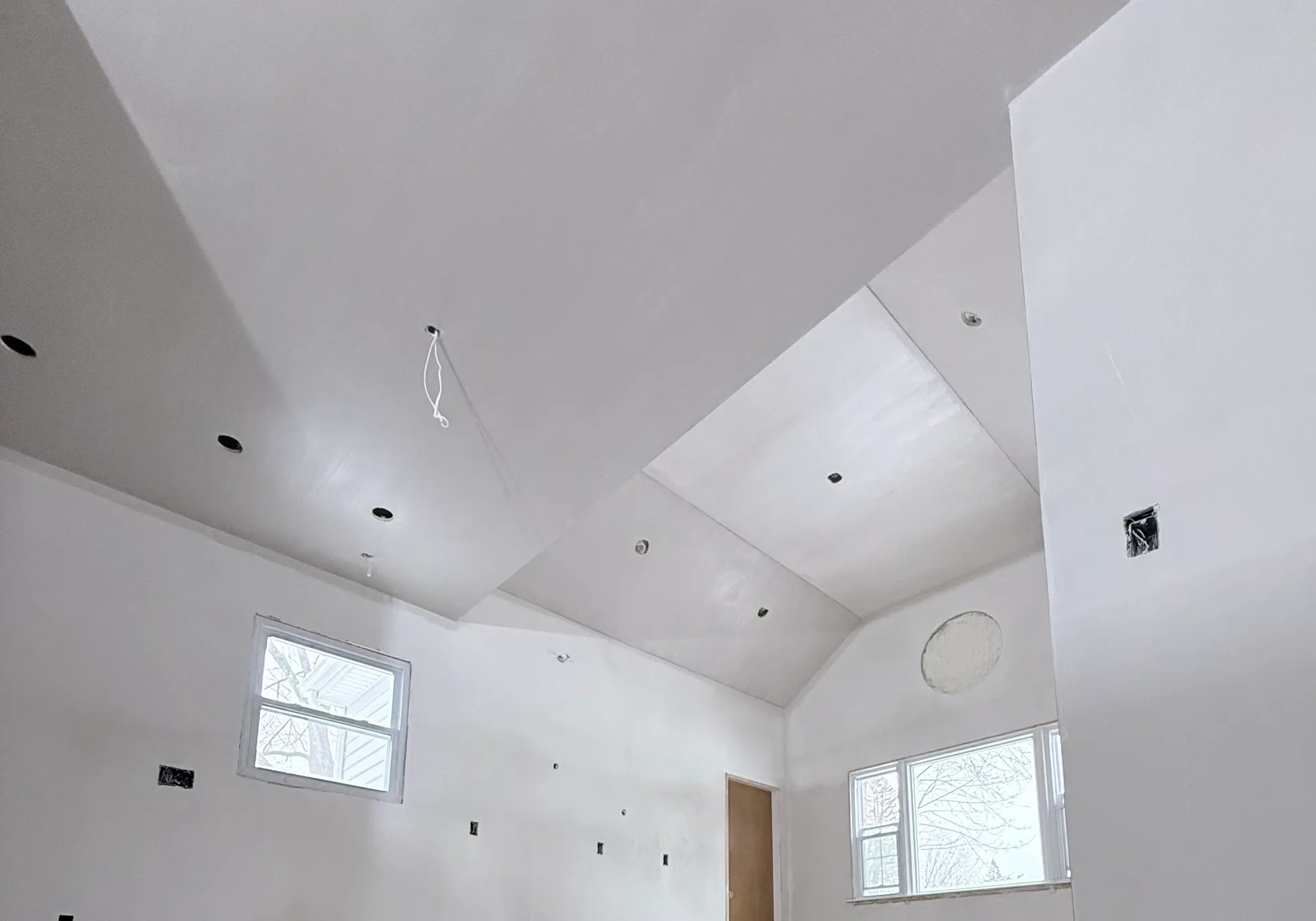 Patriot Plastering worker plastering a ceiling