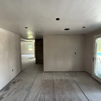 open-plan room with freshly plastered walls and ceiling