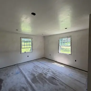 smoothly plastered room with recessed ceiling lights
