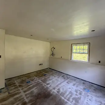 newly plastered room with smooth walls and ceiling